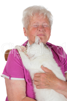 Pensioner hugging her white tomcat