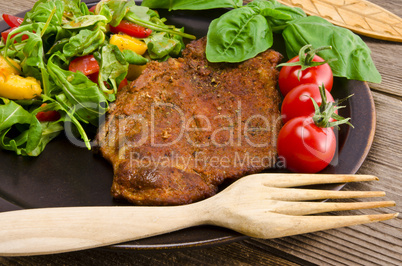 cervical chop with apricot-rocket salad