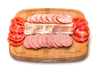 Assorted Slice Sausage, Bacon and Tomato on Cutting Board