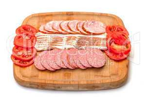 Assorted Slice Sausage, Bacon and Tomato on Cutting Board