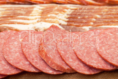 Assorted Slice Sausage and Bacon on Cutting Board