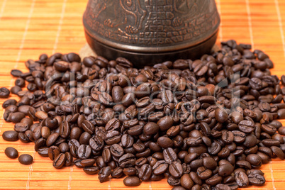 Cezve and Coffee Beans on Bamboo Mat