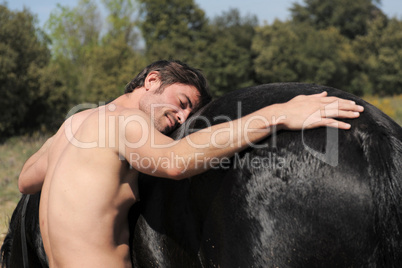 naked man and stallion