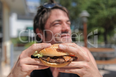 man and hamburger