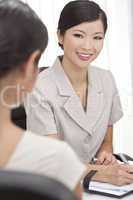 Asian Chinese Woman or Businesswoman in Office Meeting