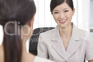 Asian Chinese Woman or Businesswoman in Office Meeting