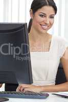 Hispanic Latina Woman or Businesswoman Using Computer in Office