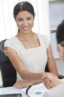 Hispanic Woman Businesswoman Shaking Hands in Office