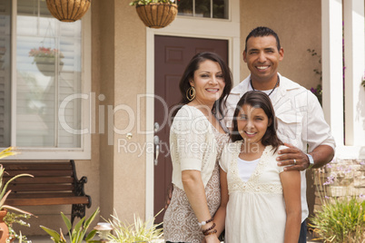 Small Hispanic Family in Front of Their Home