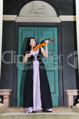 Woman playing violin in the park