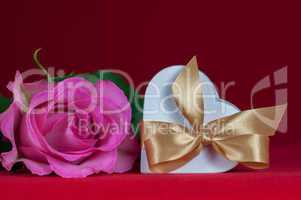 heart shaped gift box with  pink rose