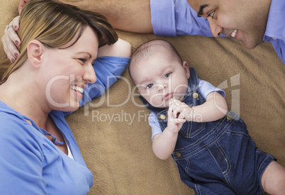 Mixed Race Family Playing on the Blanket