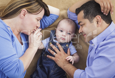 Mixed Race Family Playing on the Blanket