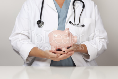 Doctor with Stethoscope Holding Piggy Bank Abstract