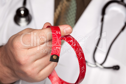 Doctor with Stethoscope Holding Measuring Tape