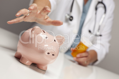Doctor with Medicine Bottles Reaches for Piggy Bank.