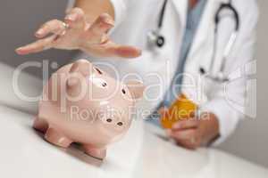 Doctor with Medicine Bottles Reaches for Piggy Bank.