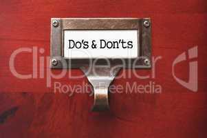 Lustrous Wooden Cabinet with Do's and Don'ts File Label