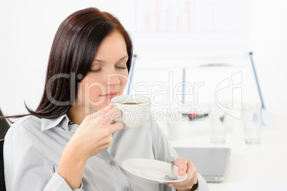 Pretty businesswoman drink coffee
