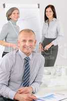 Smiling businessman during team meeting