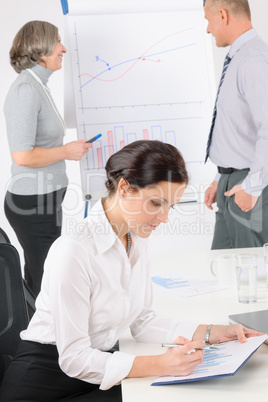 Giving presentation young woman during meeting