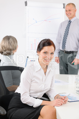 Giving presentation young woman during meeting