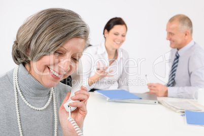 Senior business woman on the phone
