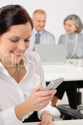 Young executive woman use phone during meeting