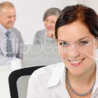 Smiling attractive businesswoman in office closeup