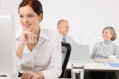 Young executive woman look at computer