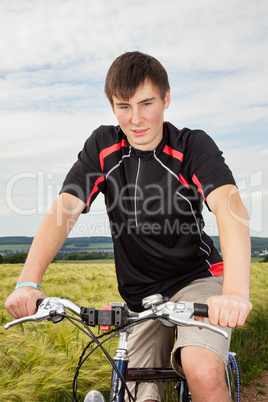 Young man riding a bicycle