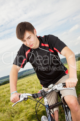 Young man riding a bicycle