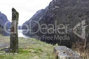 standing stone at coastline in norway