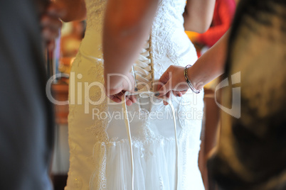 Wedding gown being tied up