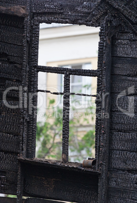 Burned wooden window frame