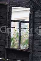 Burned wooden window frame