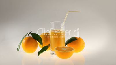 natural Orange juice in glass with straw
