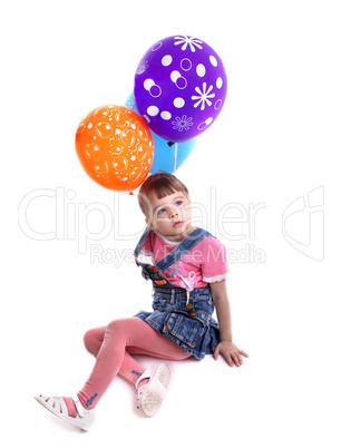Little girl with colored balloons