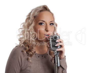 Blonde woman with vintage microphone