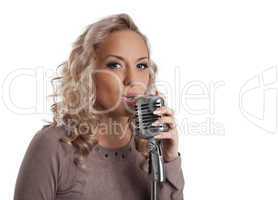 Blonde woman with vintage microphone