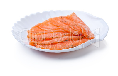 Sliced red fish on plate