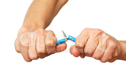 Hands breaking pencil