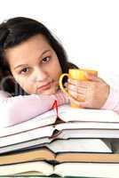 Teenage girl with books and cup