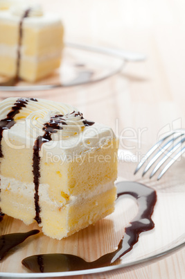 fresh cream cake closeup with chocolate sauce