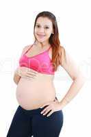 pregnant woman caressing her belly over white background