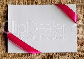 gift card with ribbon on canvas textile