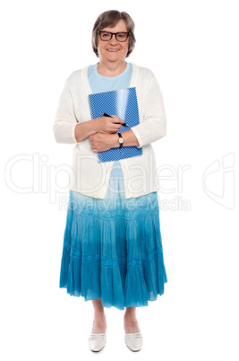 Cheerful lady holding office stationery