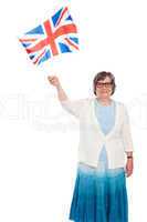 Senior lady holding UK flag and waving