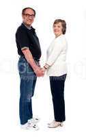 Love couple holding hands. Full length shot