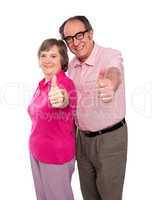 Senior couple gesturing thumbs up